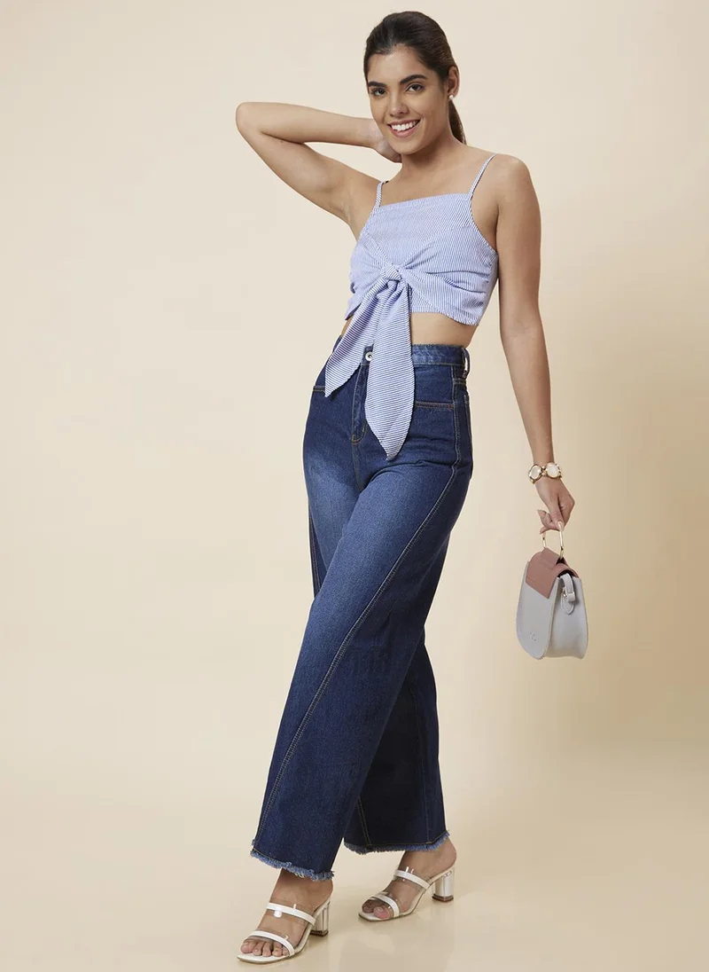 جلو باص جينز نسائي واسع الساق أزرق متوسط الخصر بتأثير باهت خفيف وخطوط